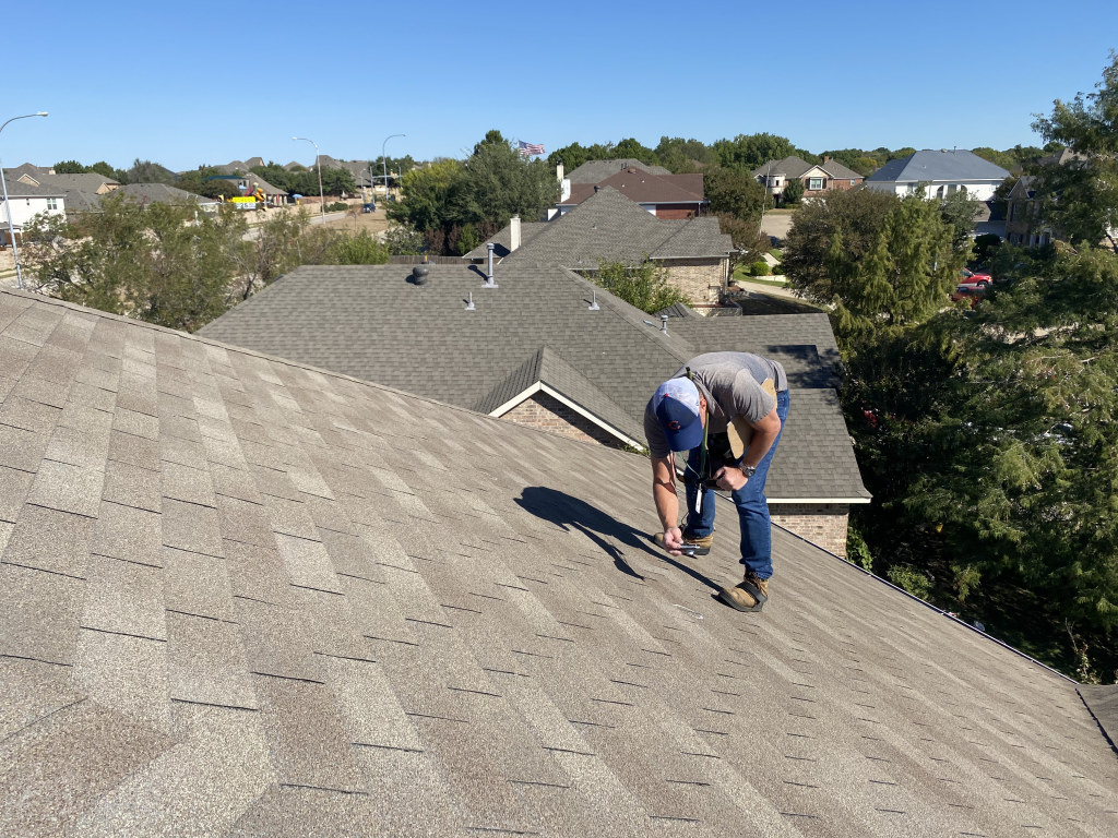 NLRC team members conducting a professional hail damage roof inspection