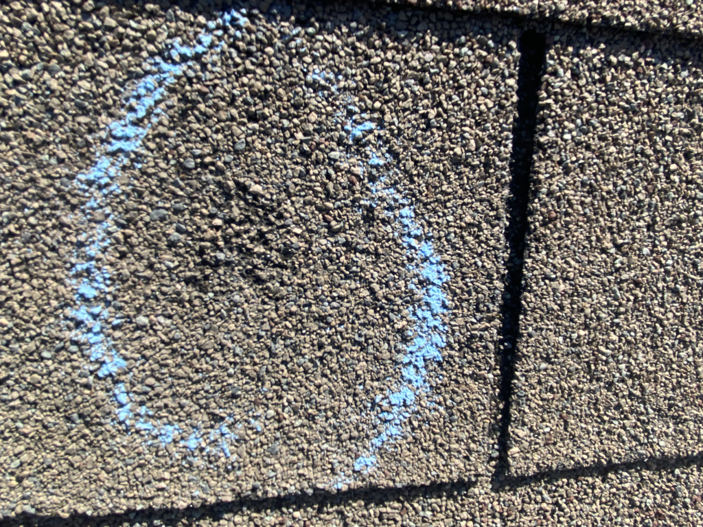 Hail damage marked on a roof in Frisco TX