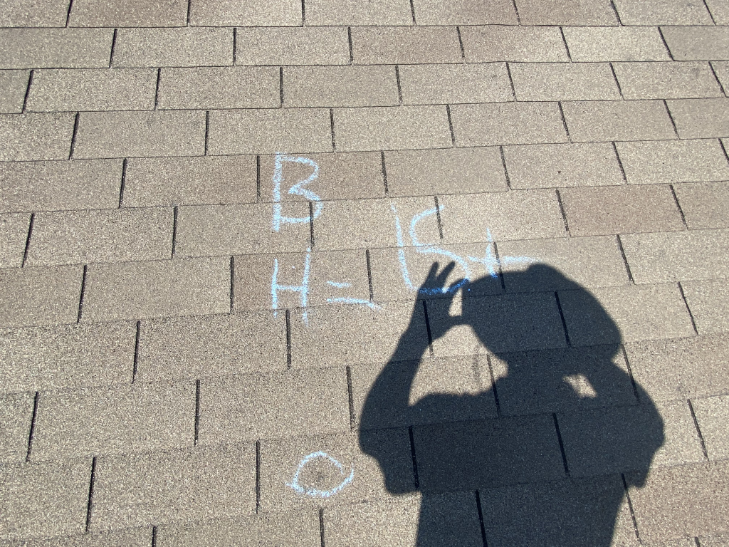 Detailed roof inspection on a steep-pitch Southlake TX roof