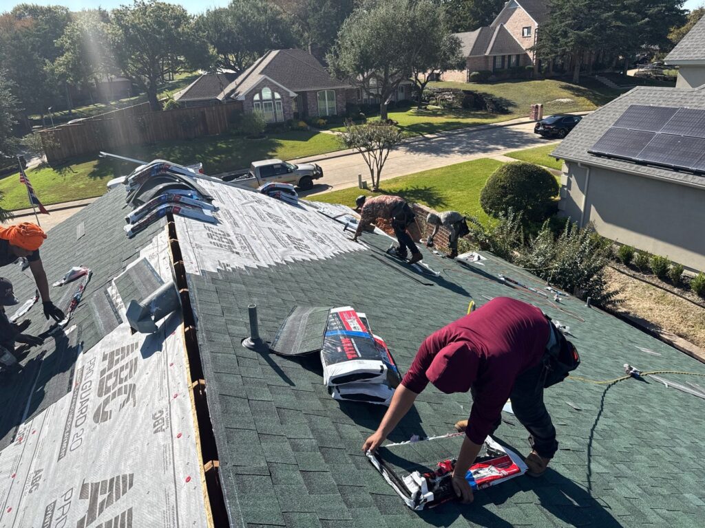 NLRC crew installing shingles on a residential roof near DeSoto Texas